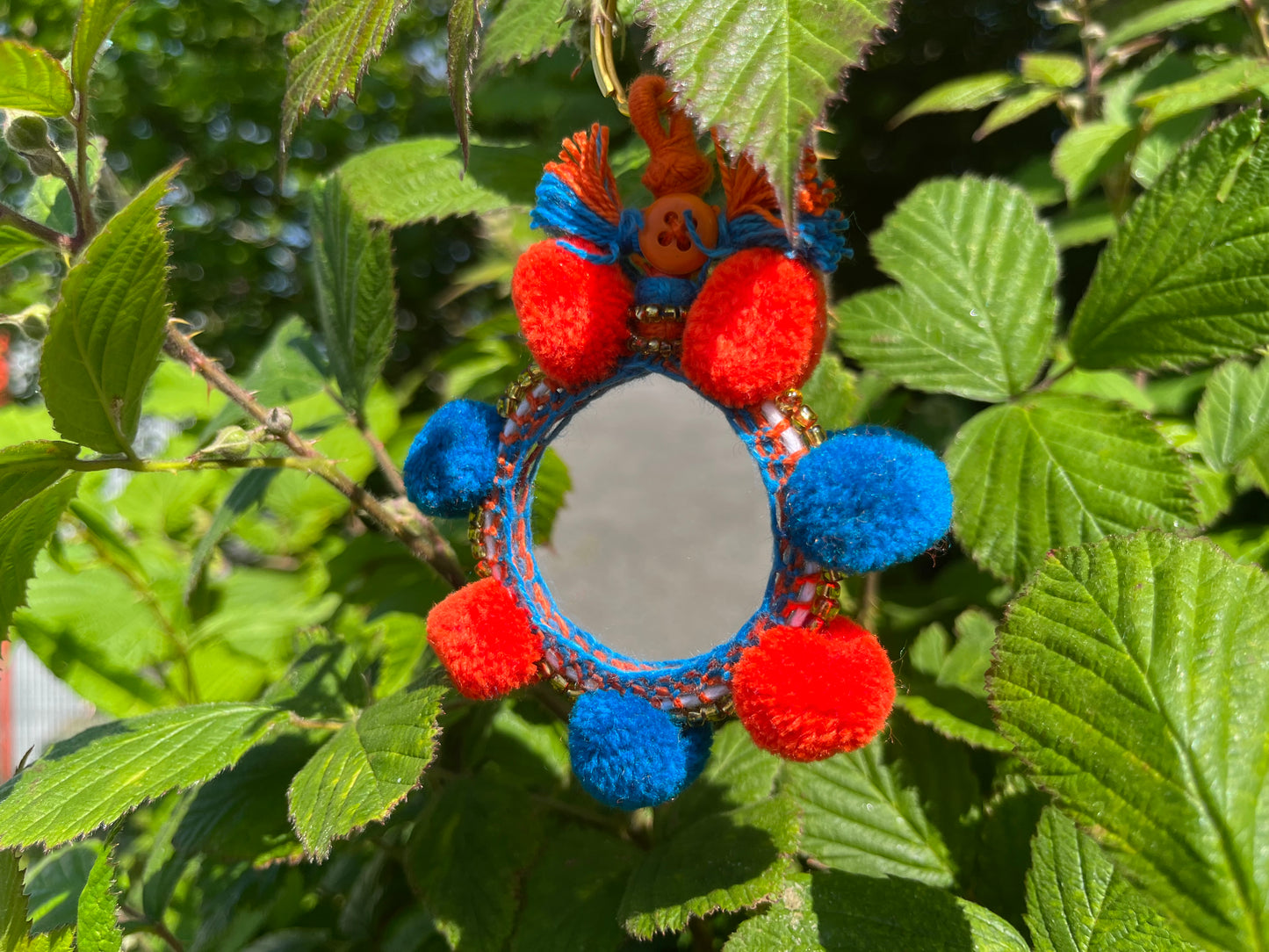 Orange and Blue Pom Mirror